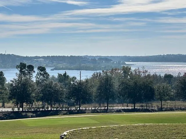 a view of a city with lawn