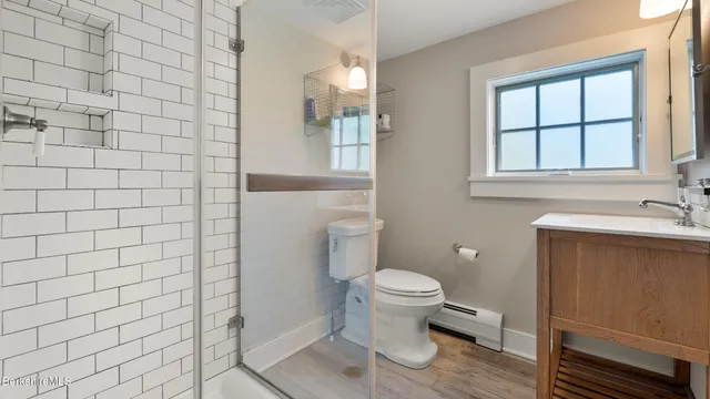 a bathroom with a toilet and a sink