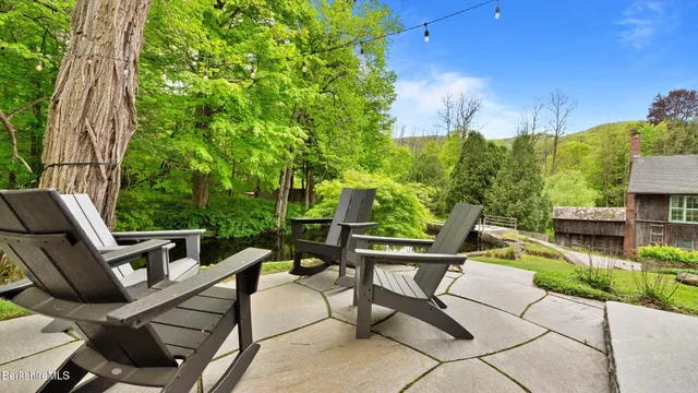 a view of an chairs and table in the patio