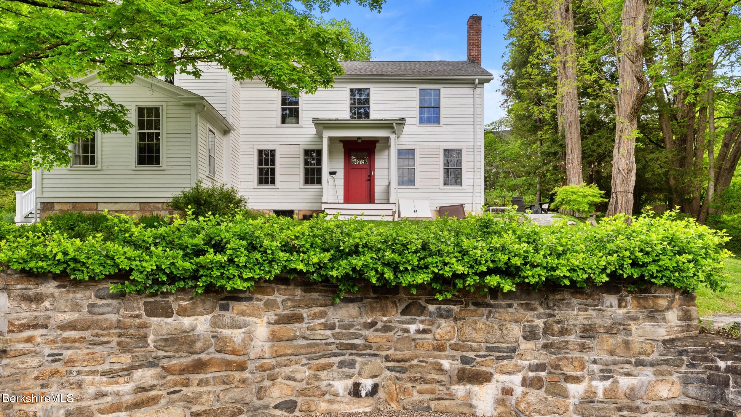 8 Yale Hill Road Stockbridge, MA 01262 - Photo 10 of 51 a front view of a house with a yard