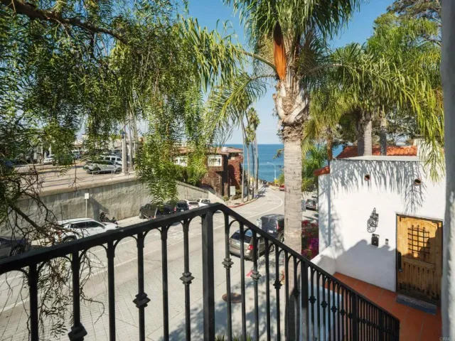 a view of a wooden bridge and trees