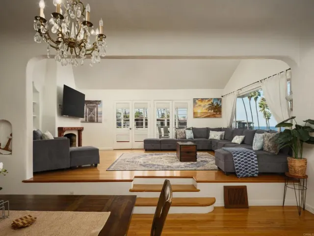 a living room with fireplace furniture and a flat screen tv