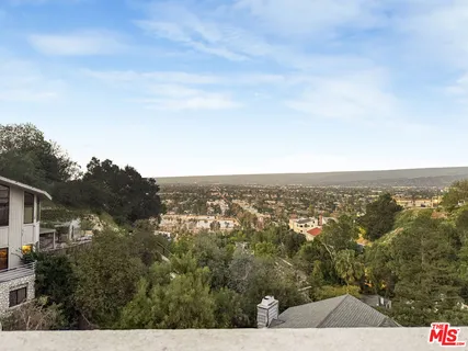 a view of a city with mountain