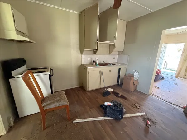 a room with furniture mirror and wooden floor