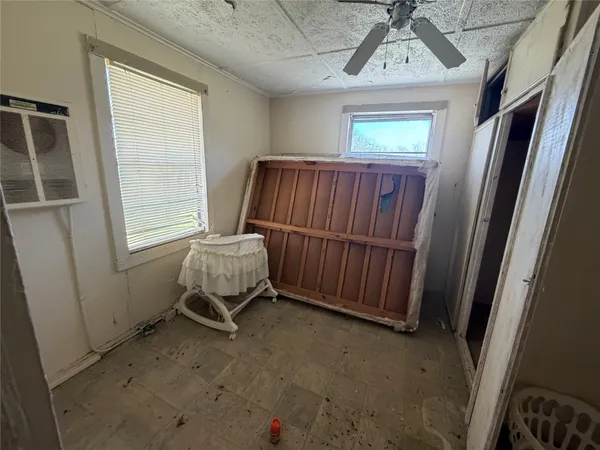 a view of a room with furniture and a window