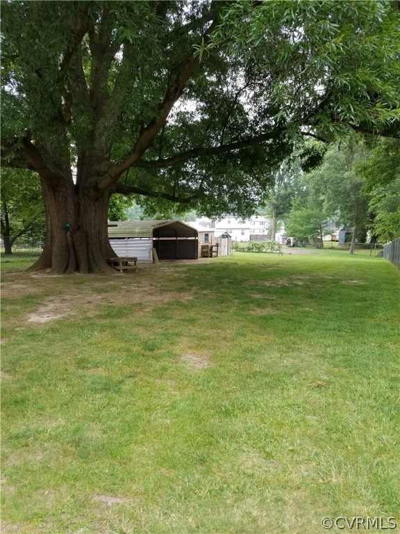 531 Cedar Level Road Hopewell, VA 23860 - Photo 5 of 7 a backyard of a house with table and chairs