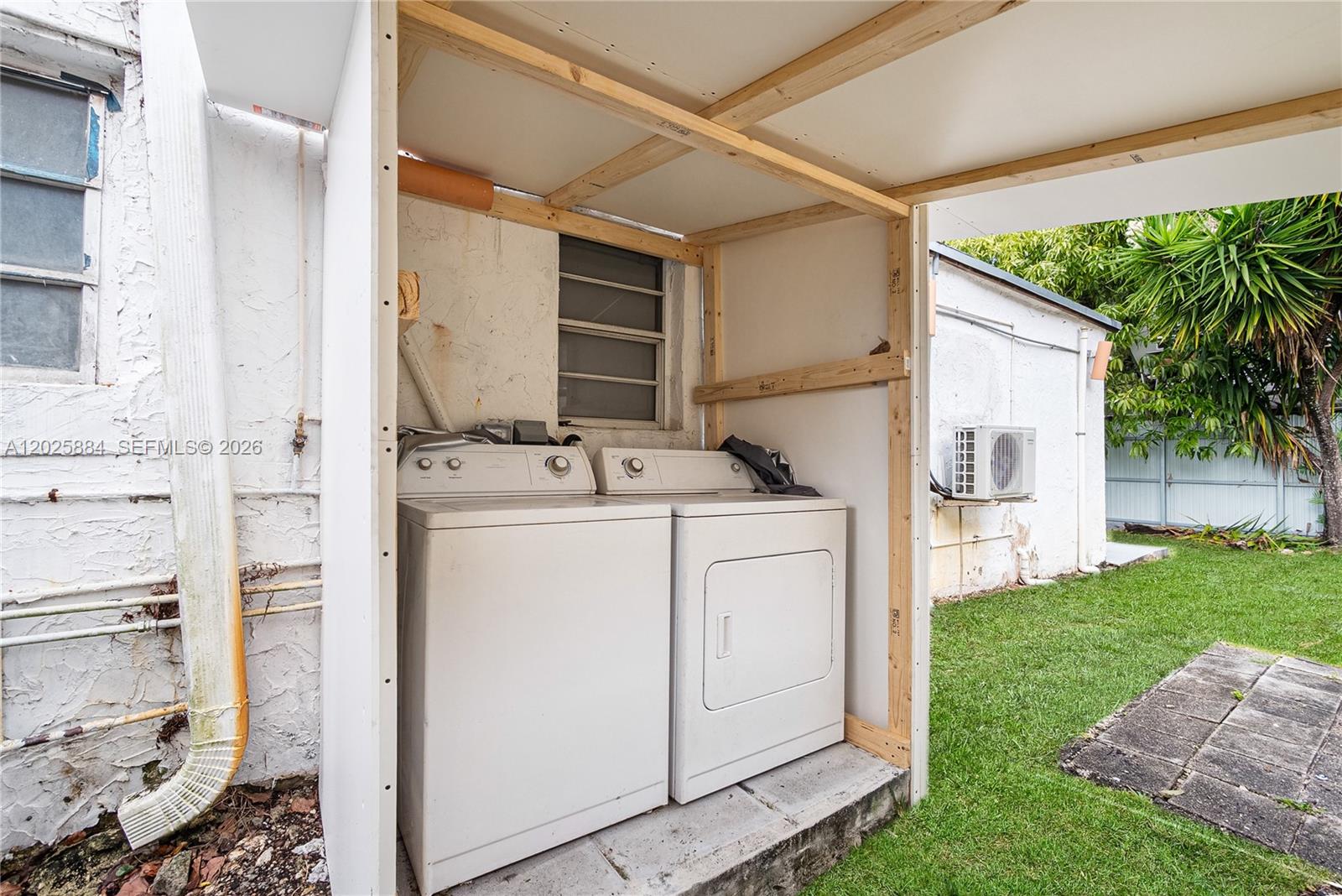 2255 Southwest 10th Street, Unit B Miami, FL 33135 - Photo 3 of 26 a utility room with dryer and washer