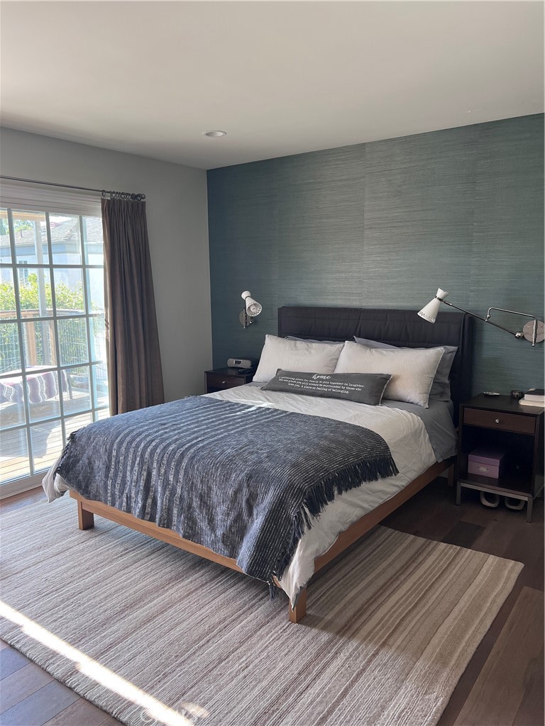 16 Seton Road Irvine, CA 92612 - Photo 12 of 31 a bedroom with a bed and wooden floor