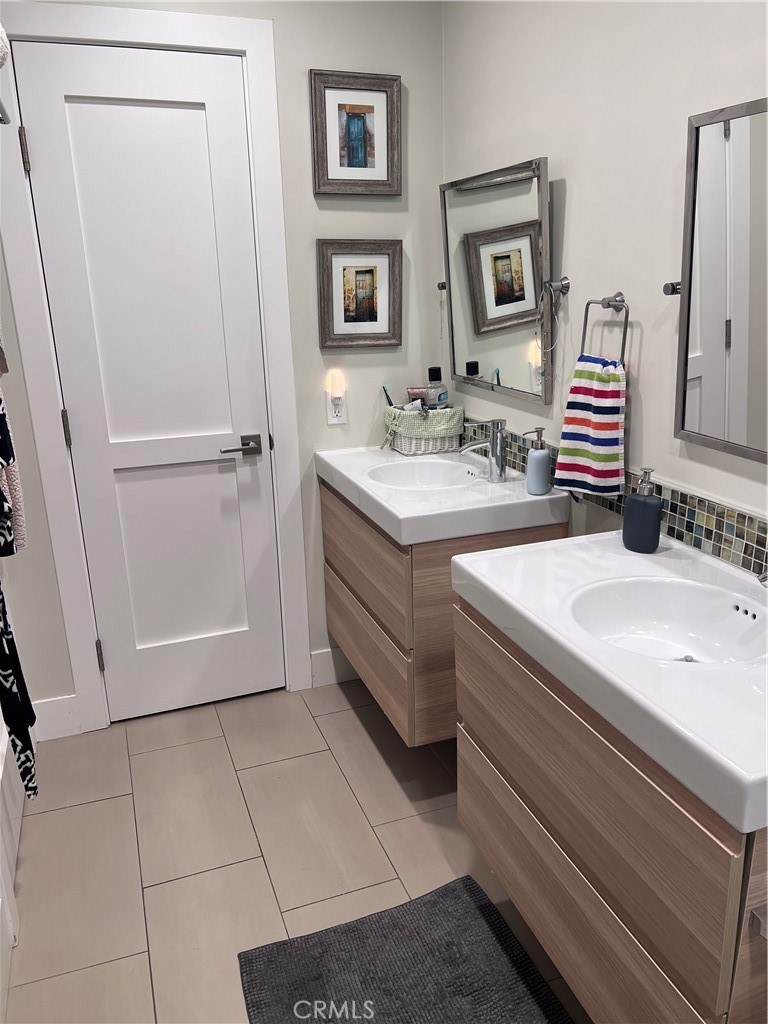 16 Seton Road Irvine, CA 92612 - Photo 25 of 31 a bathroom with a sink and a mirror