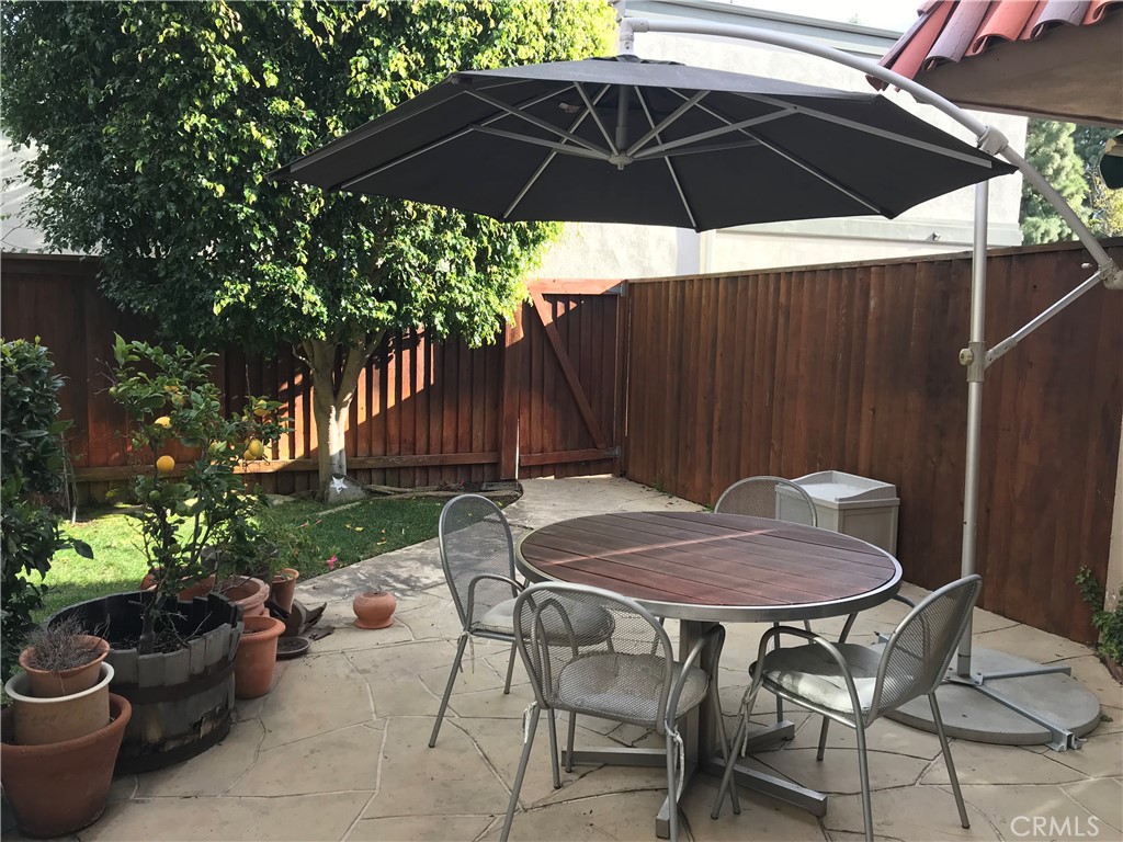 16 Seton Road Irvine, CA 92612 - Photo 29 of 31 a view of a table and chairs under an umbrella
