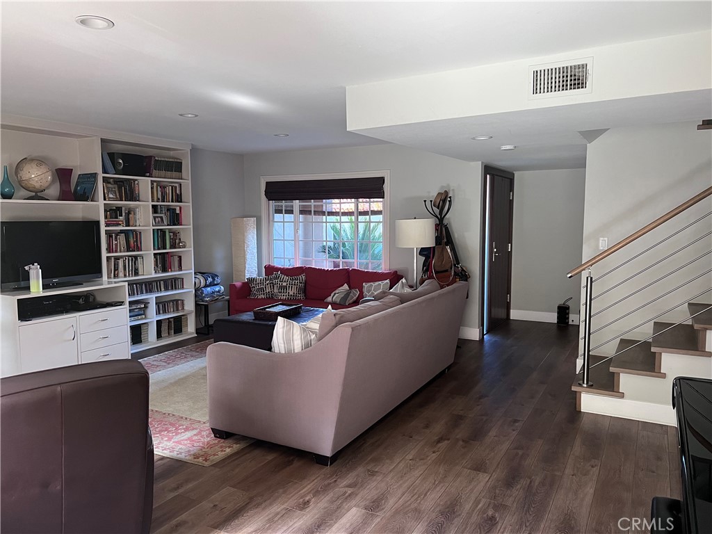 16 Seton Road Irvine, CA 92612 - Photo 3 of 31 a living room with furniture and a flat screen tv