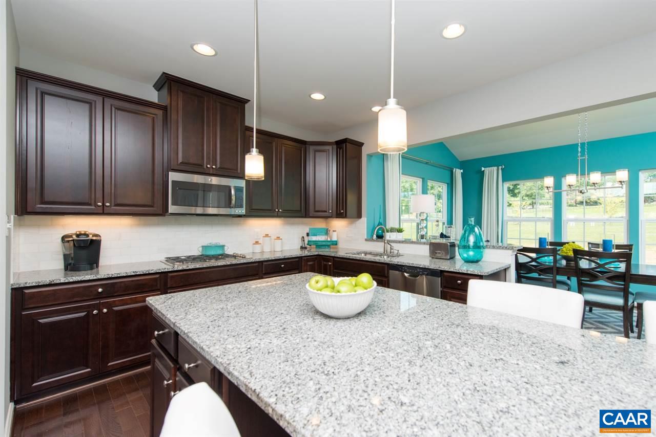 68 Ridgemont Road Ruckersville, VA 22968 - Photo 4 of 20 a kitchen with stainless steel appliances granite countertop a sink stove and refrigerator