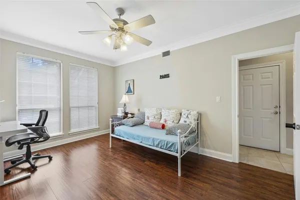 a living room with a bed furniture and a window