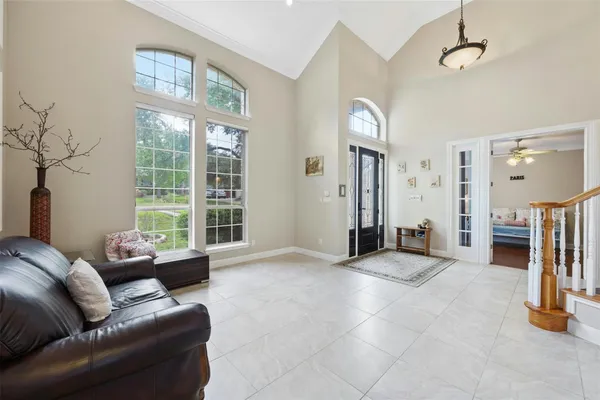 a living room with furniture and a large window