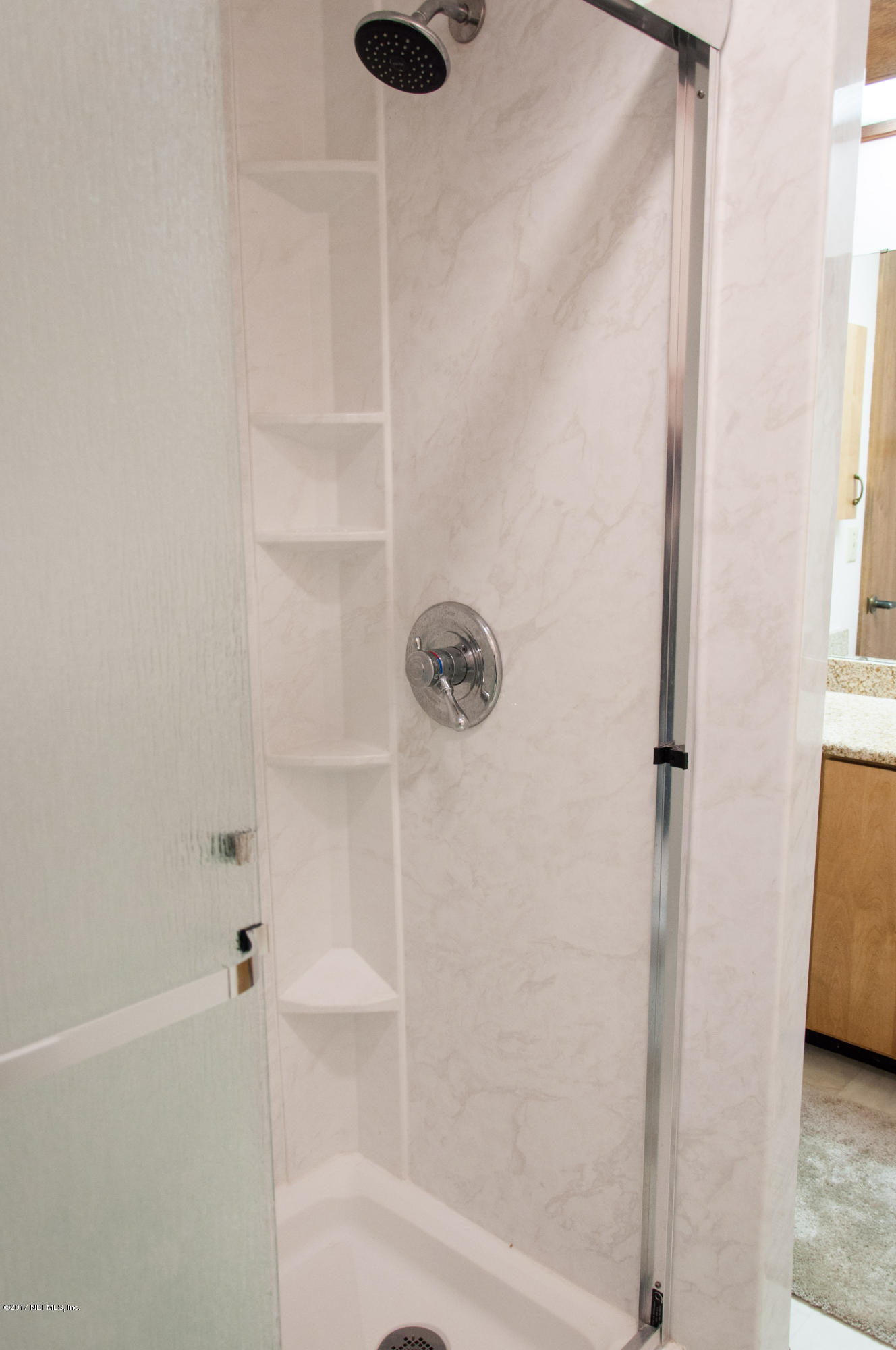 5461 Spring Brook Road Jacksonville, FL 32277 - Photo 30 of 38 a bathroom with a bathtub