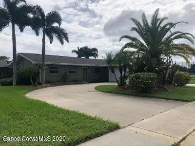 a view of a backyard with potted plants