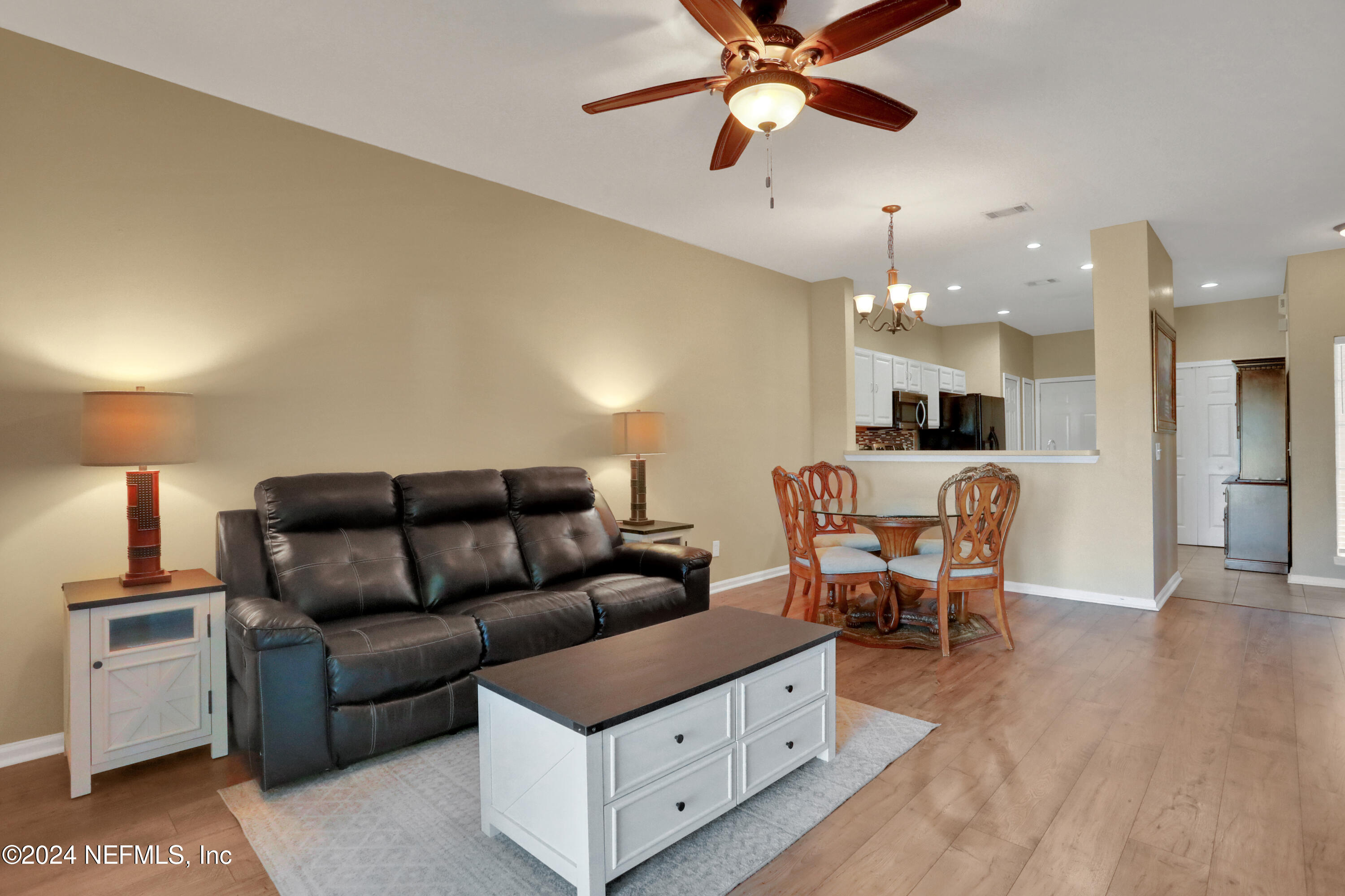513 Scrub Jay Drive St. Augustine, FL 32092 - Photo 10 of 25 a living room with furniture and a wooden floor