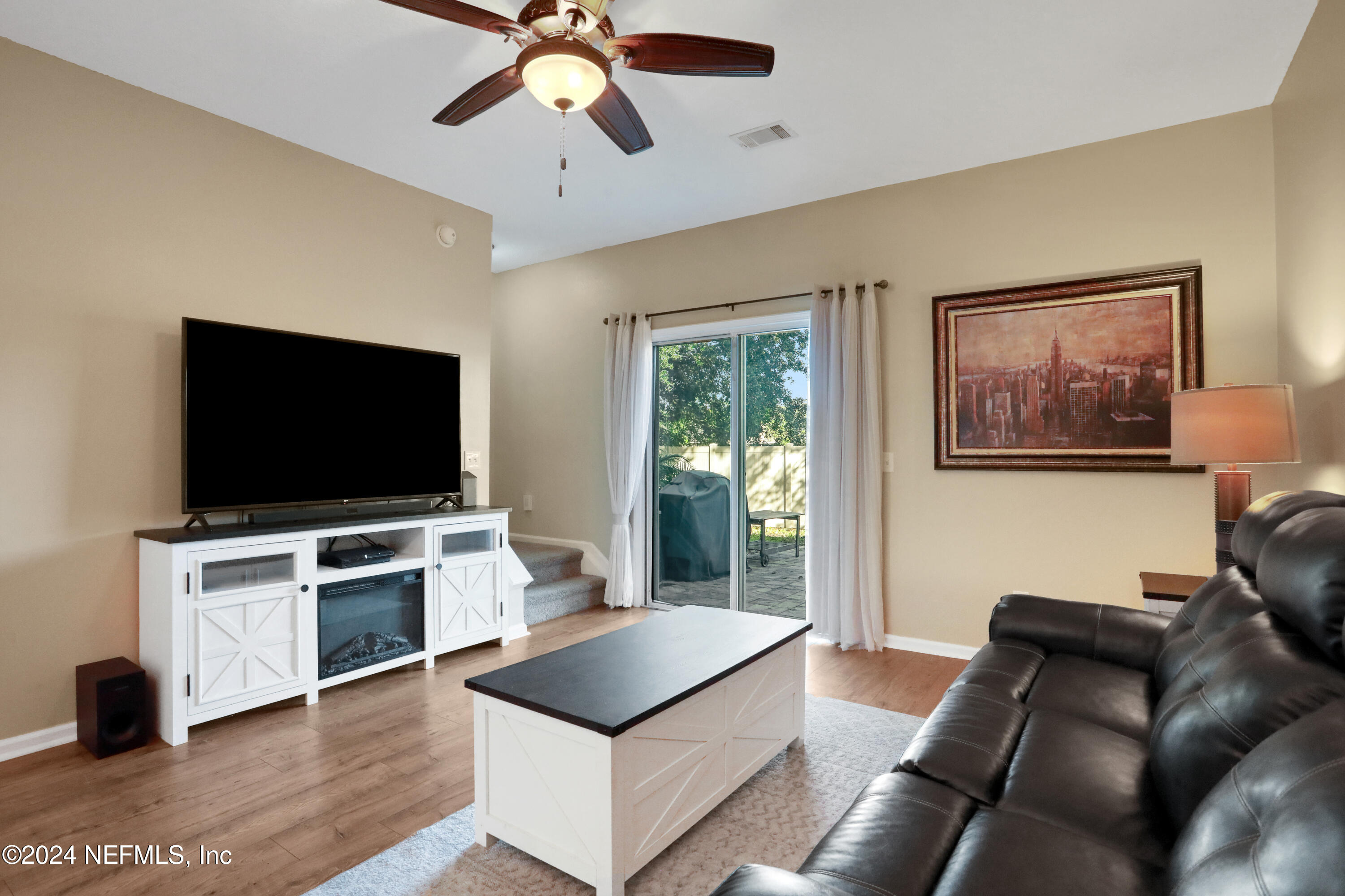 513 Scrub Jay Drive St. Augustine, FL 32092 - Photo 11 of 25 a living room with furniture and a flat screen tv
