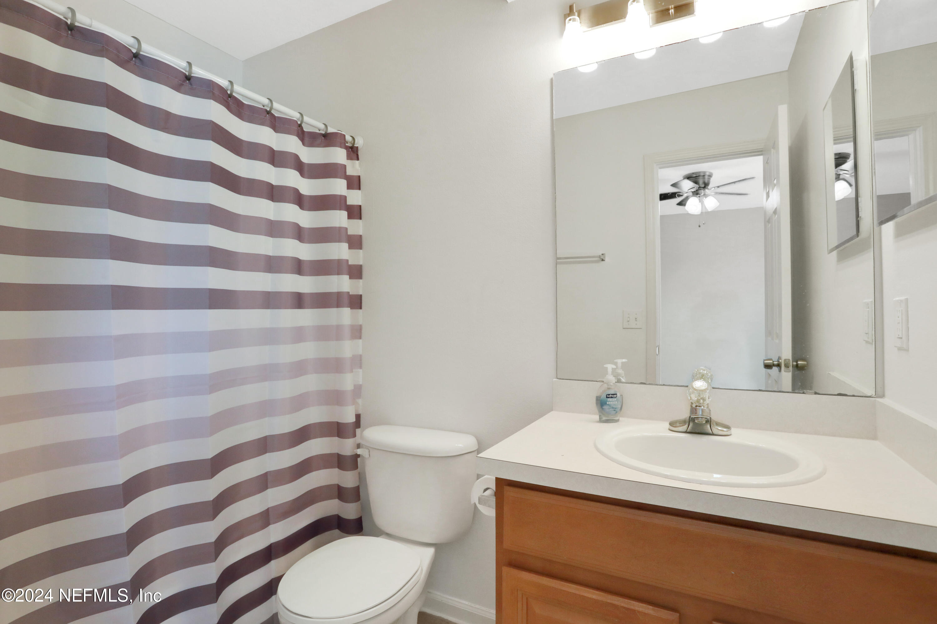 513 Scrub Jay Drive St. Augustine, FL 32092 - Photo 15 of 25 a bathroom with a sink toilet and shower