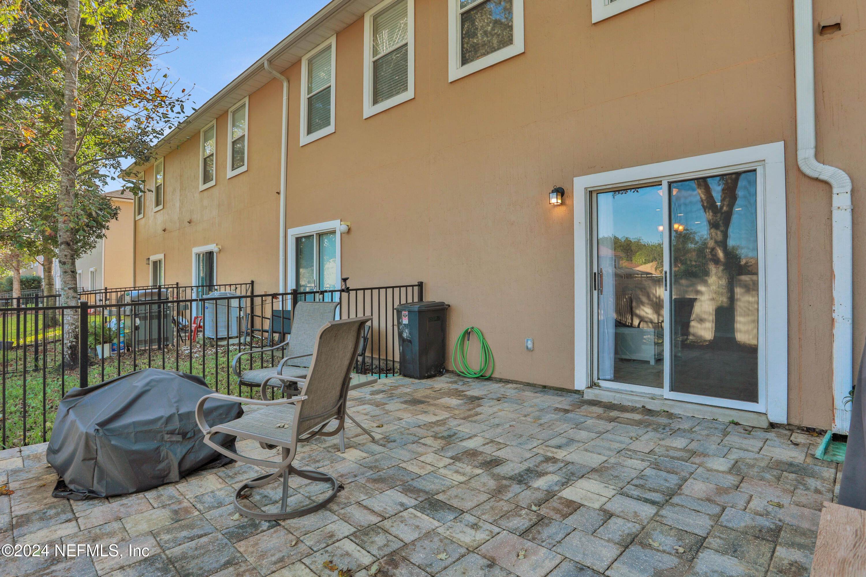 513 Scrub Jay Drive St. Augustine, FL 32092 - Photo 18 of 25 a view of a chair and tables in the balcony