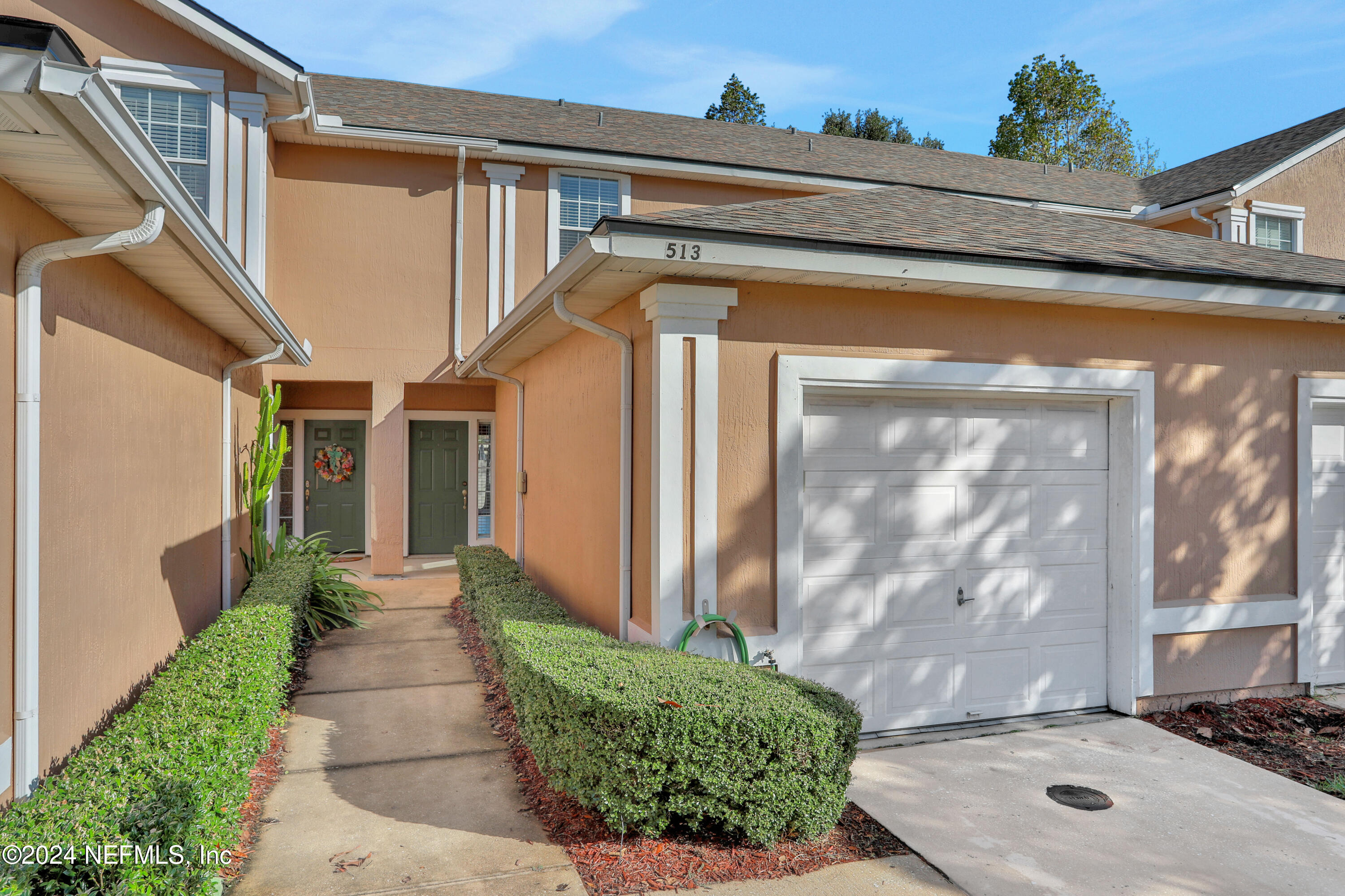 513 Scrub Jay Drive St. Augustine, FL 32092 - Photo 19 of 25 a front view of a house with a yard