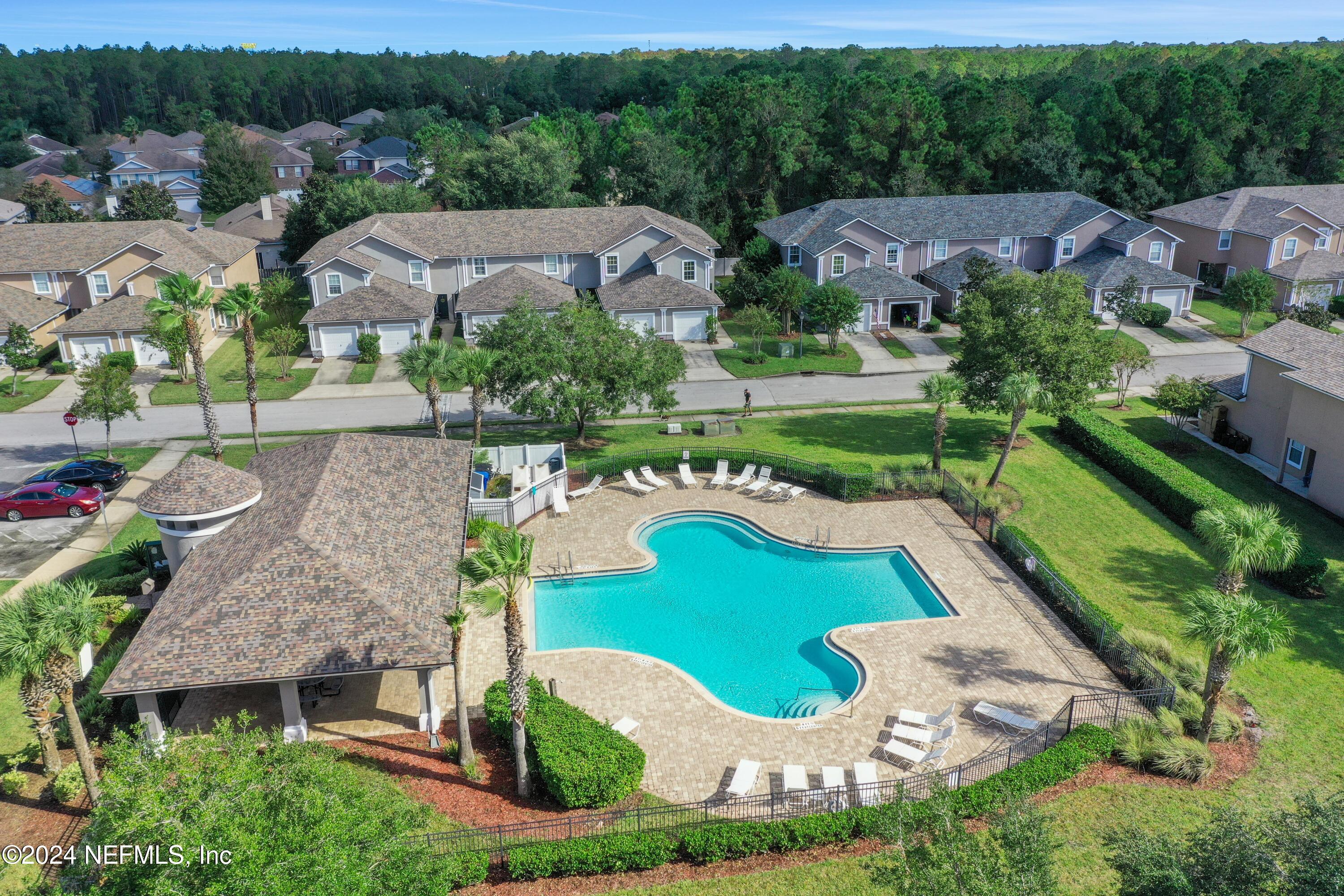 513 Scrub Jay Drive St. Augustine, FL 32092 - Photo 23 of 25 an aerial view of multiple houses with yard