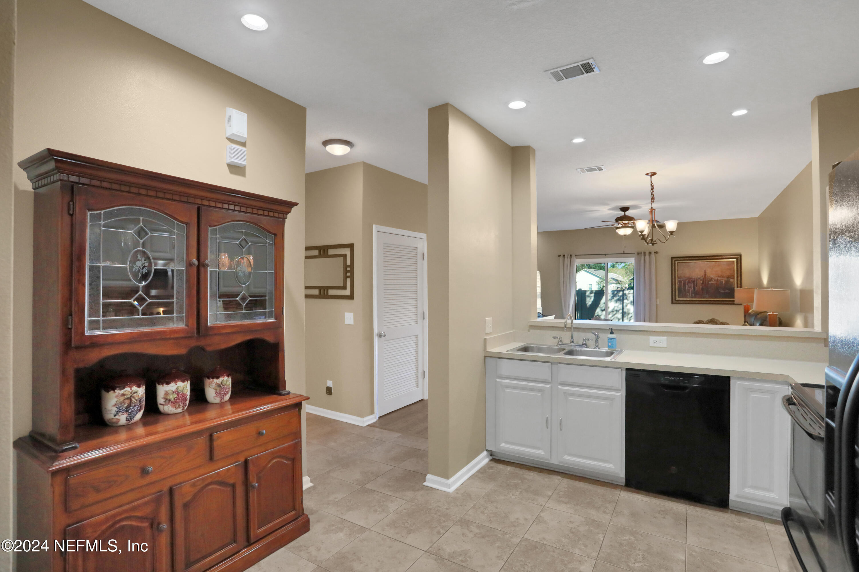 513 Scrub Jay Drive St. Augustine, FL 32092 - Photo 7 of 25 a kitchen with stainless steel appliances granite countertop a refrigerator and a sink