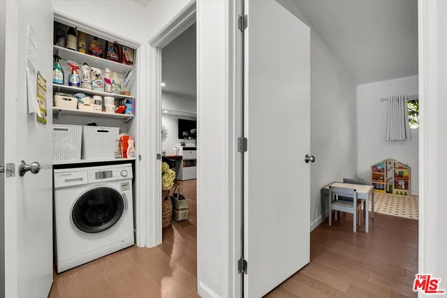 a view of a livingroom with furniture and workspace