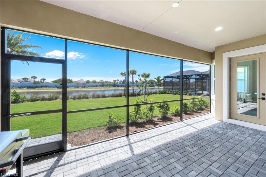 8850 Calypso Court Naples, FL 34113 - Photo 26 of 41 Screened lanai with a water view