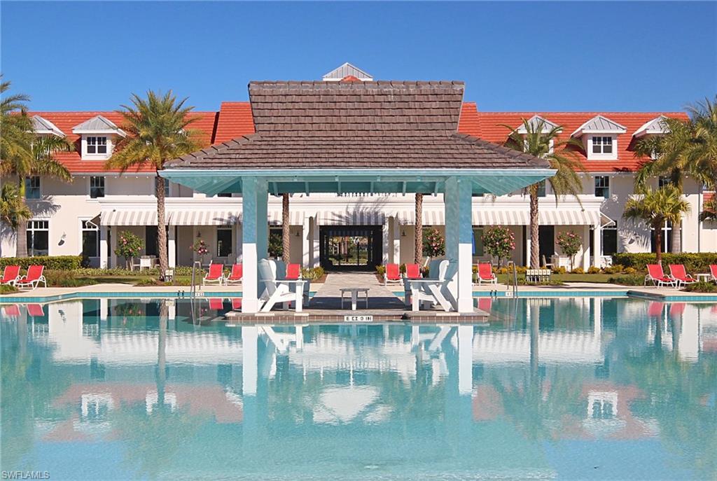 8850 Calypso Court Naples, FL 34113 - Photo 40 of 41 Community pool featuring a patio area