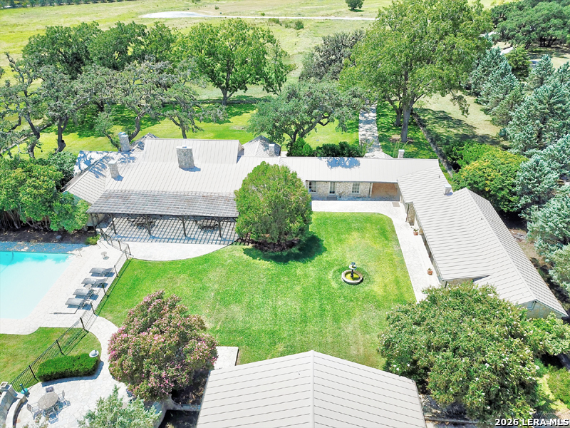 Lot 76 Horseshoe Bandera, TX 78003 - Photo 9 of 10 a view of a backyard with potted plants
