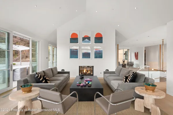a living room with furniture and windows