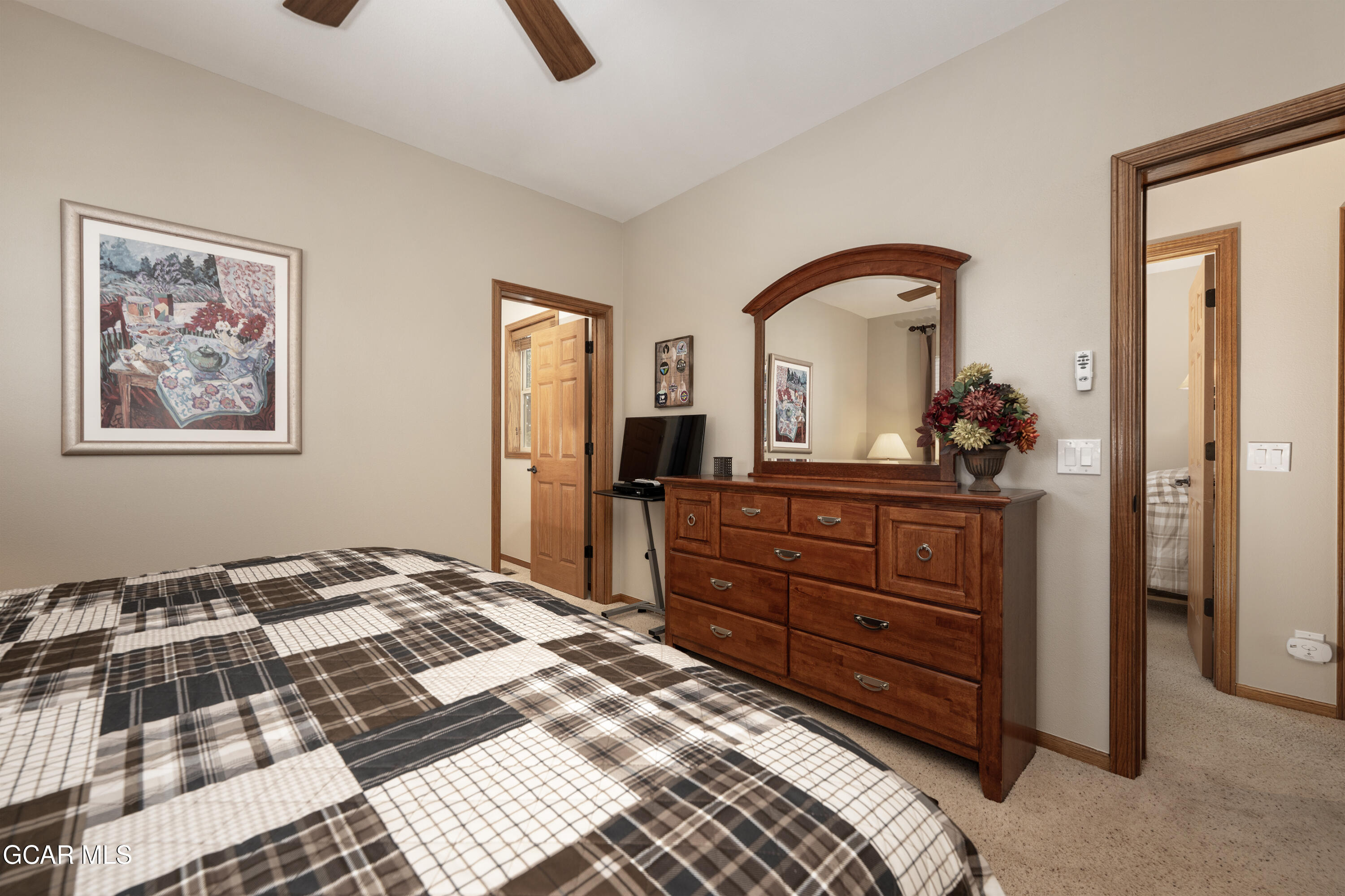 840 Ferret Lane Fraser, CO 80442 - Photo 11 of 33 a bedroom with a bed and a dresser