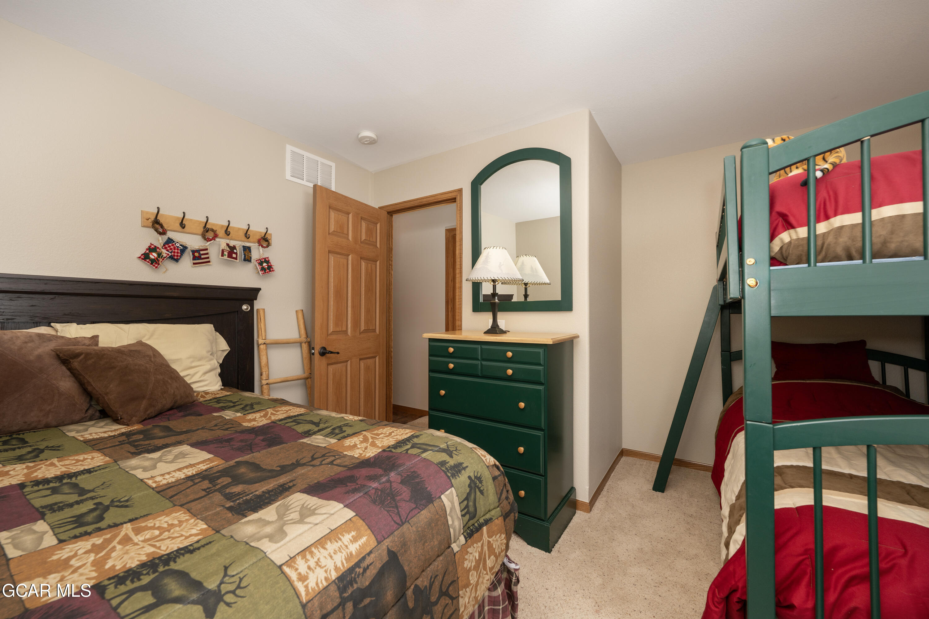 840 Ferret Lane Fraser, CO 80442 - Photo 22 of 33 a bedroom with a bed and a dresser