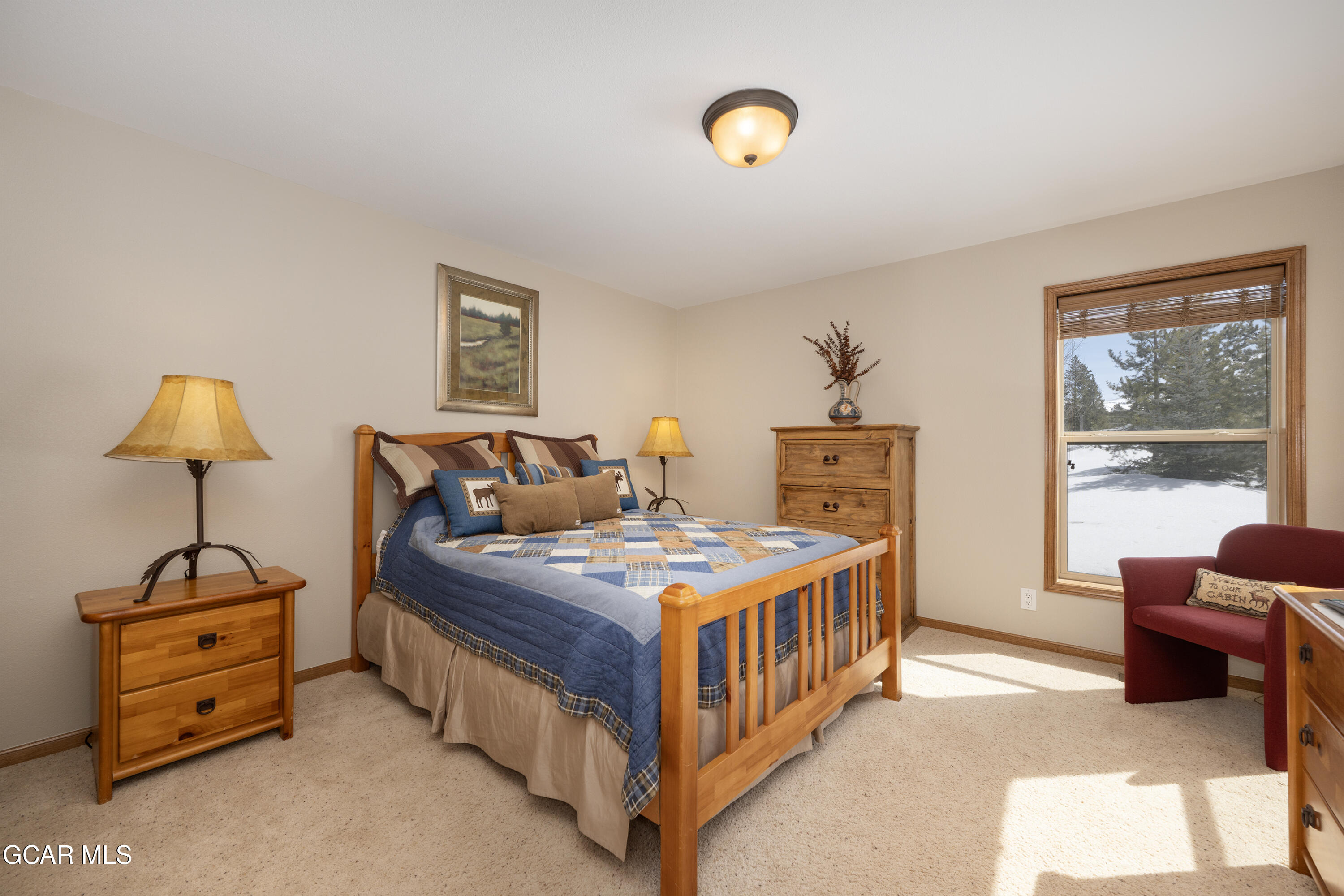 840 Ferret Lane Fraser, CO 80442 - Photo 23 of 33 a bedroom with a bed and dresser