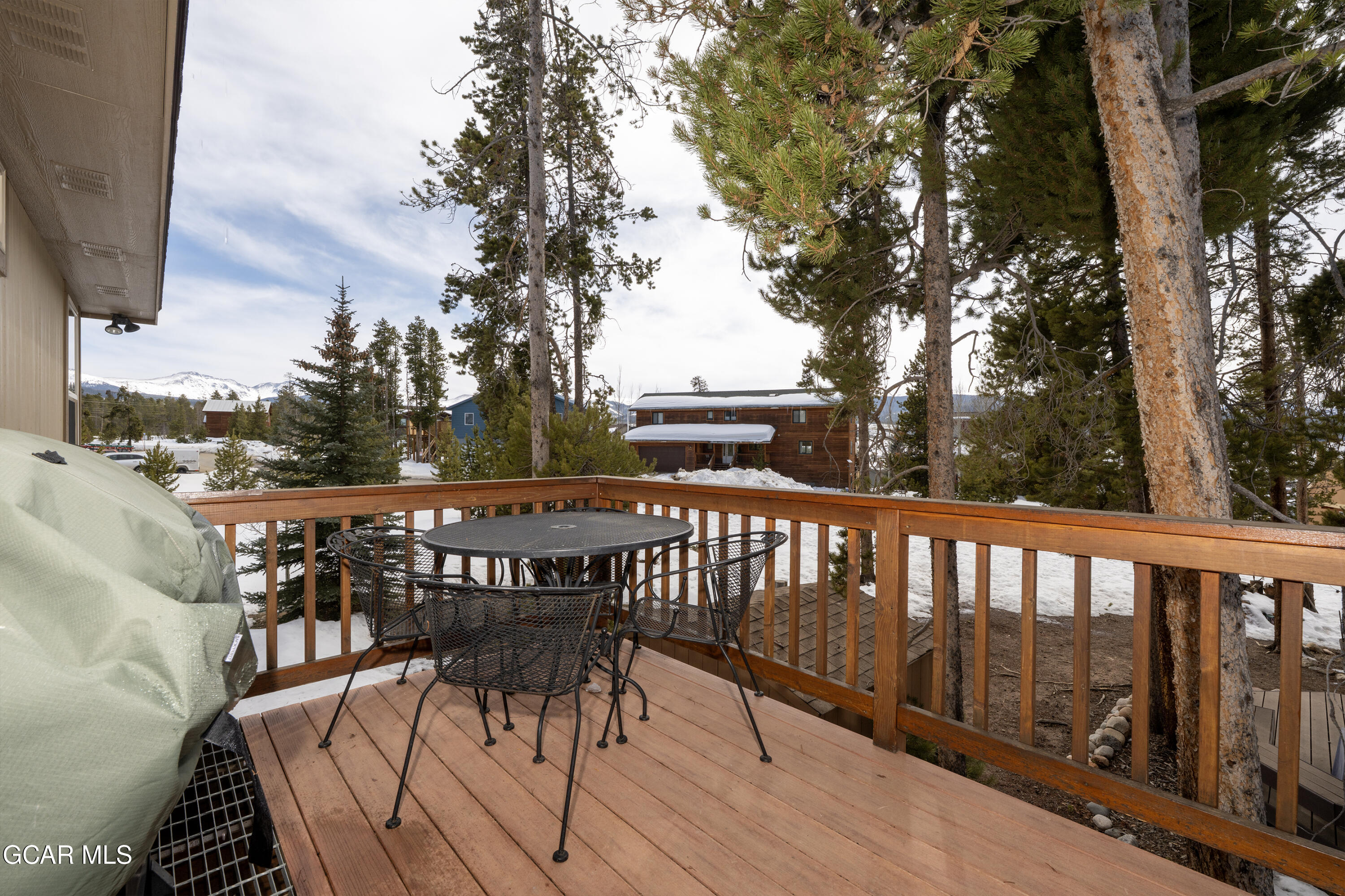 840 Ferret Lane Fraser, CO 80442 - Photo 7 of 33 a view of balcony with wooden floor and outdoor seating