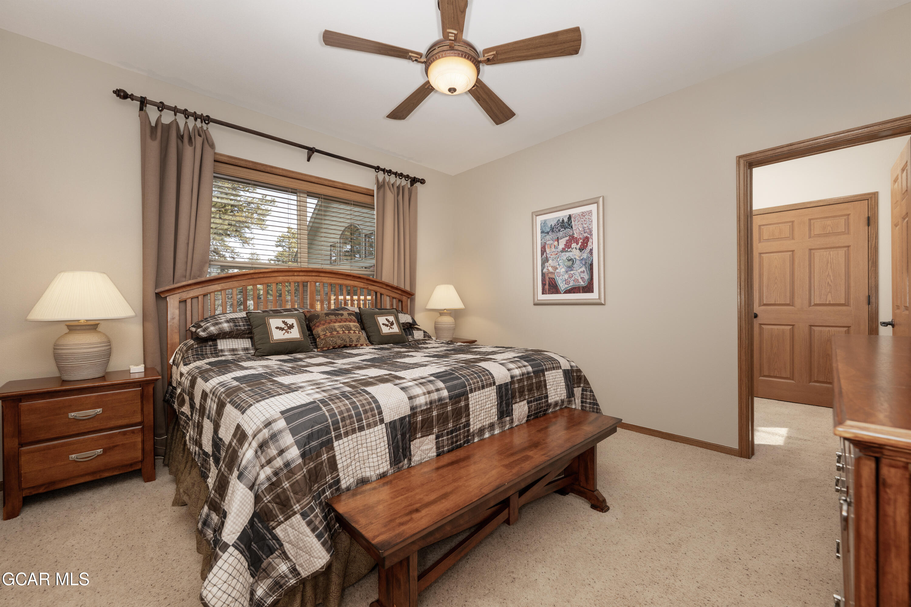 840 Ferret Lane Fraser, CO 80442 - Photo 10 of 33 a bedroom with a bed dresser and a window