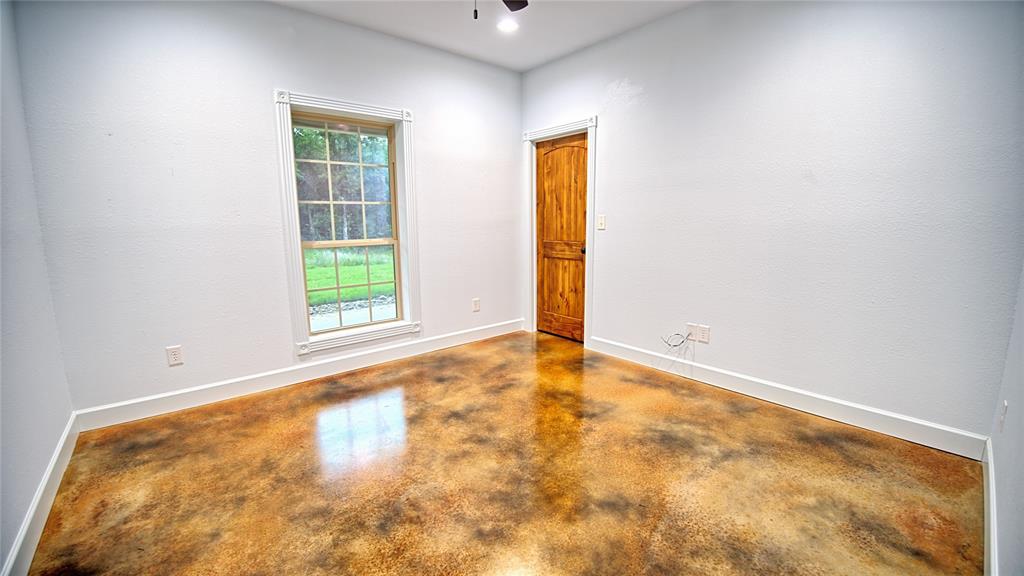 2930 North Greenbrier Road Nocona, TX 76255 - Photo 12 of 40 a view of an empty room with a window