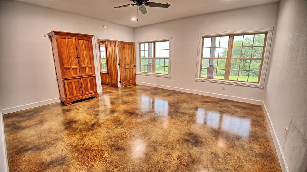 2930 North Greenbrier Road Nocona, TX 76255 - Photo 13 of 40 an empty room with windows