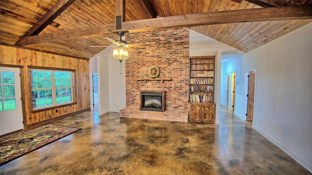 2930 North Greenbrier Road Nocona, TX 76255 - Photo 14 of 40 a view of a fireplace in an empty room