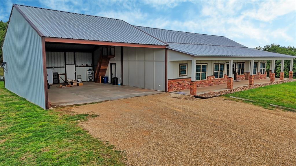 2930 North Greenbrier Road Nocona, TX 76255 - Photo 2 of 40 a front view of a house with yard and porch