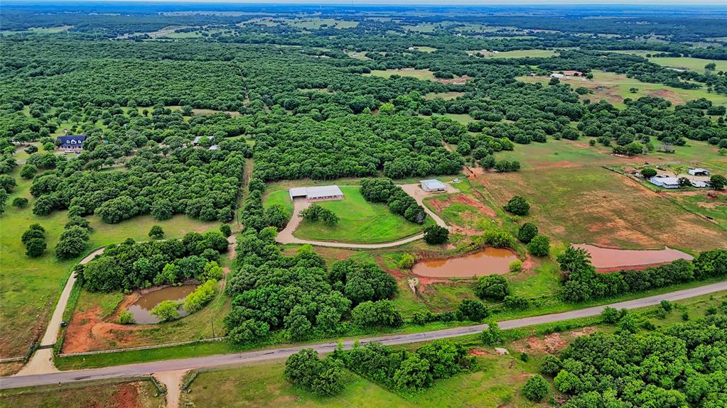 2930 North Greenbrier Road Nocona, TX 76255 - Photo 25 of 40 an aerial view of residential houses with outdoor space