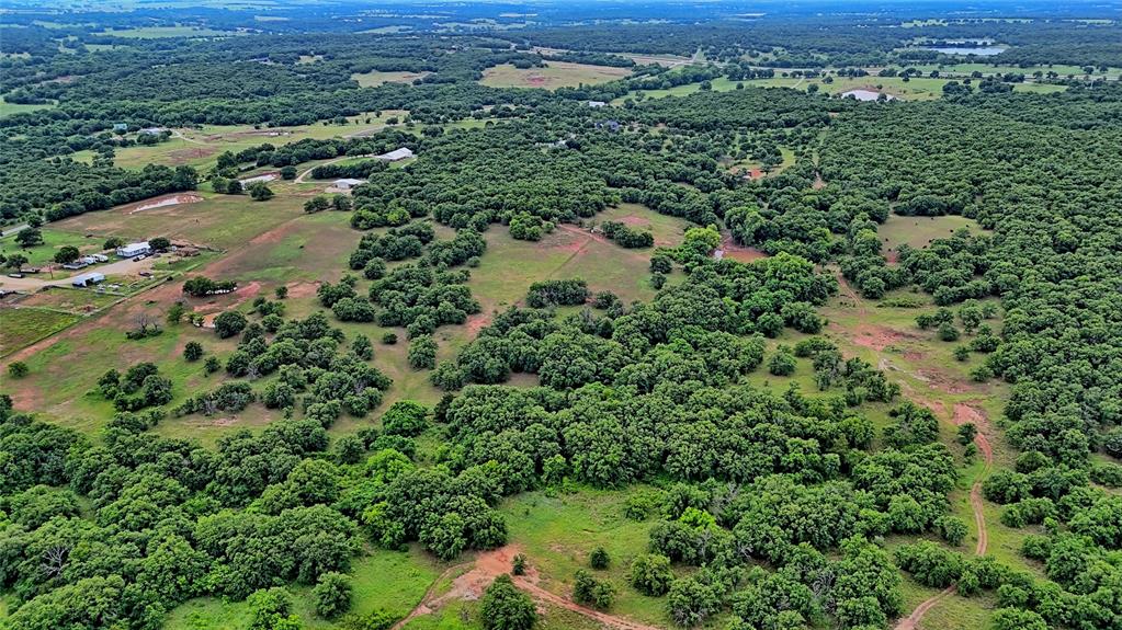 2930 North Greenbrier Road Nocona, TX 76255 - Photo 36 of 40 an aerial view of residential houses with outdoor space and trees