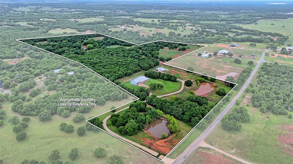 2930 North Greenbrier Road Nocona, TX 76255 - Photo 39 of 40 an aerial view of a residential houses with outdoor space