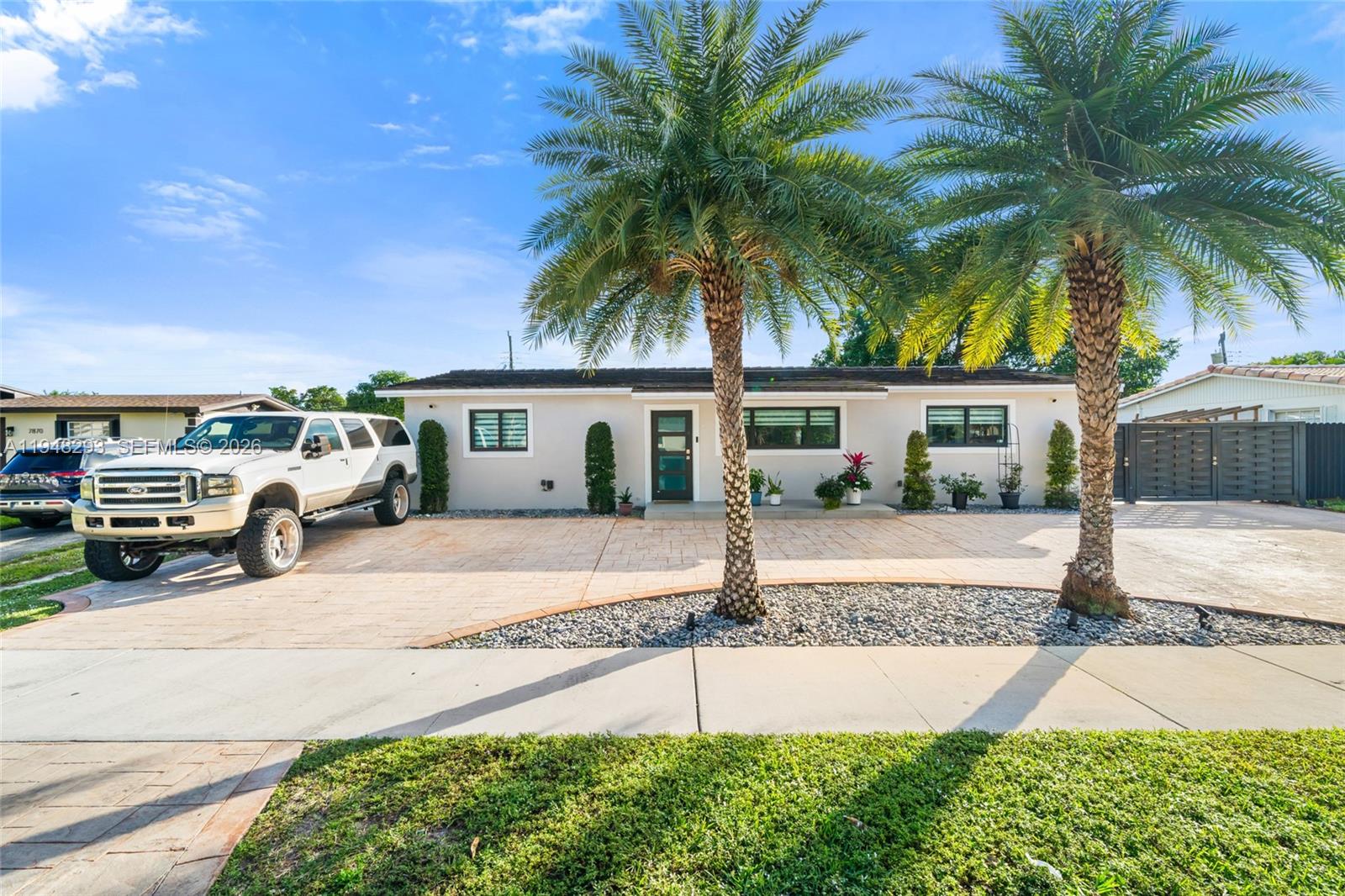 7874 Northwest 175th Street Hialeah, FL 33015 - Photo 1 of 19 a view of a house with a patio