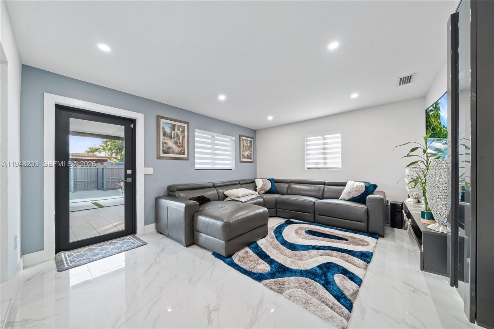 7874 Northwest 175th Street Hialeah, FL 33015 - Photo 8 of 19 a living room with furniture and a window