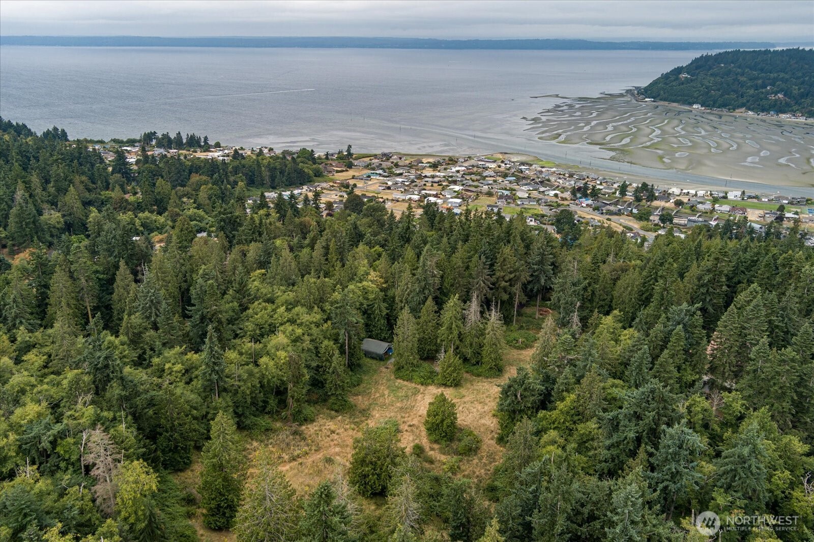 8175 Mossy Rock Road Clinton, WA 98236 - Photo 11 of 27 a view of a houses with a lake