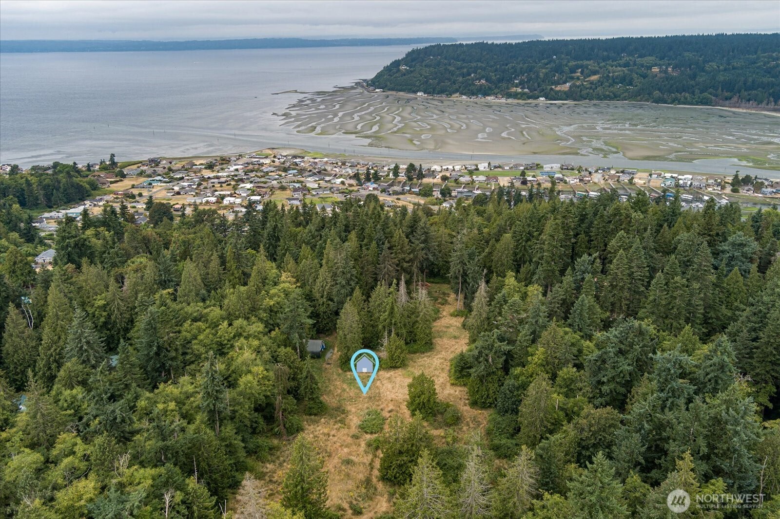 8175 Mossy Rock Road Clinton, WA 98236 - Photo 2 of 27 a view of a lake from a yard