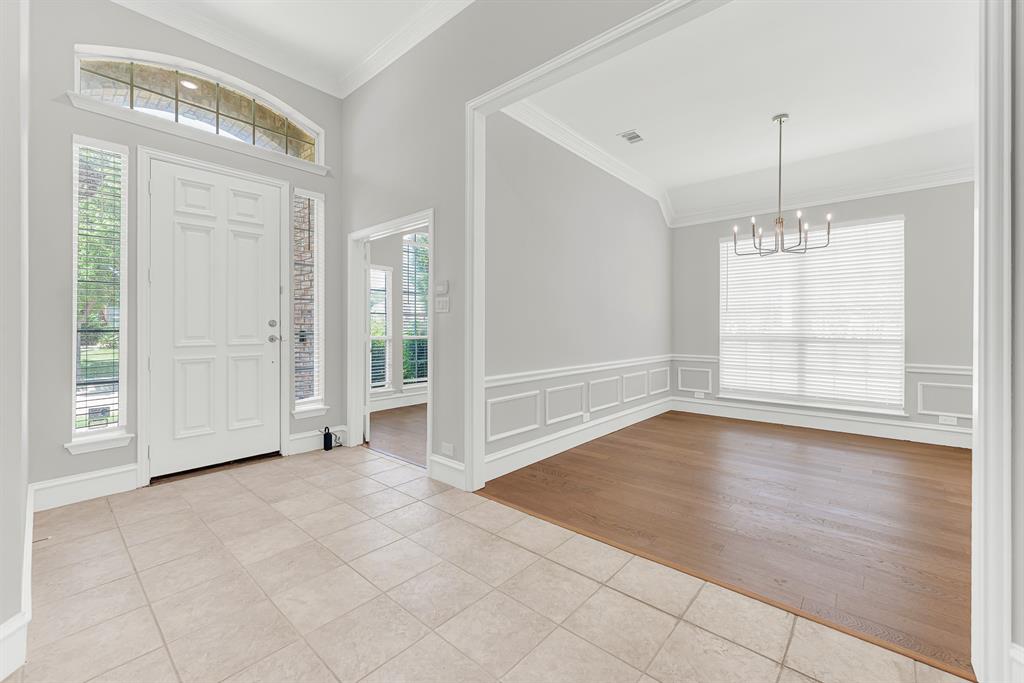 3500 Neiman Road Plano, TX 75025 - Photo 26 of 26 The entry ushers you into the tile foyer and views of the open floor plan, neutral paint and abundant natural sunshine