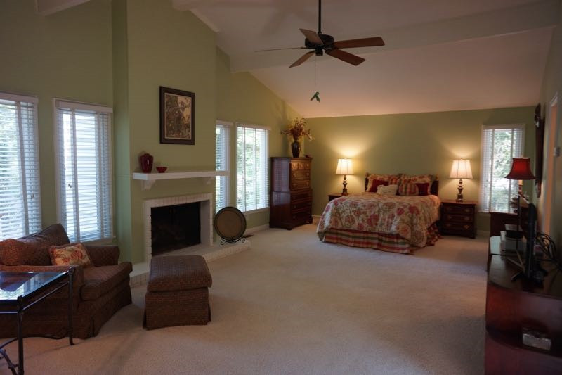 3621 Dade Street Raleigh, NC 27612 - Photo 12 of 23 The OVERSIZED Master Bedroom Suite features a fireplace, cathedral ceiling, two walk-in closets, and a ceiling fan. Master Bedroom
